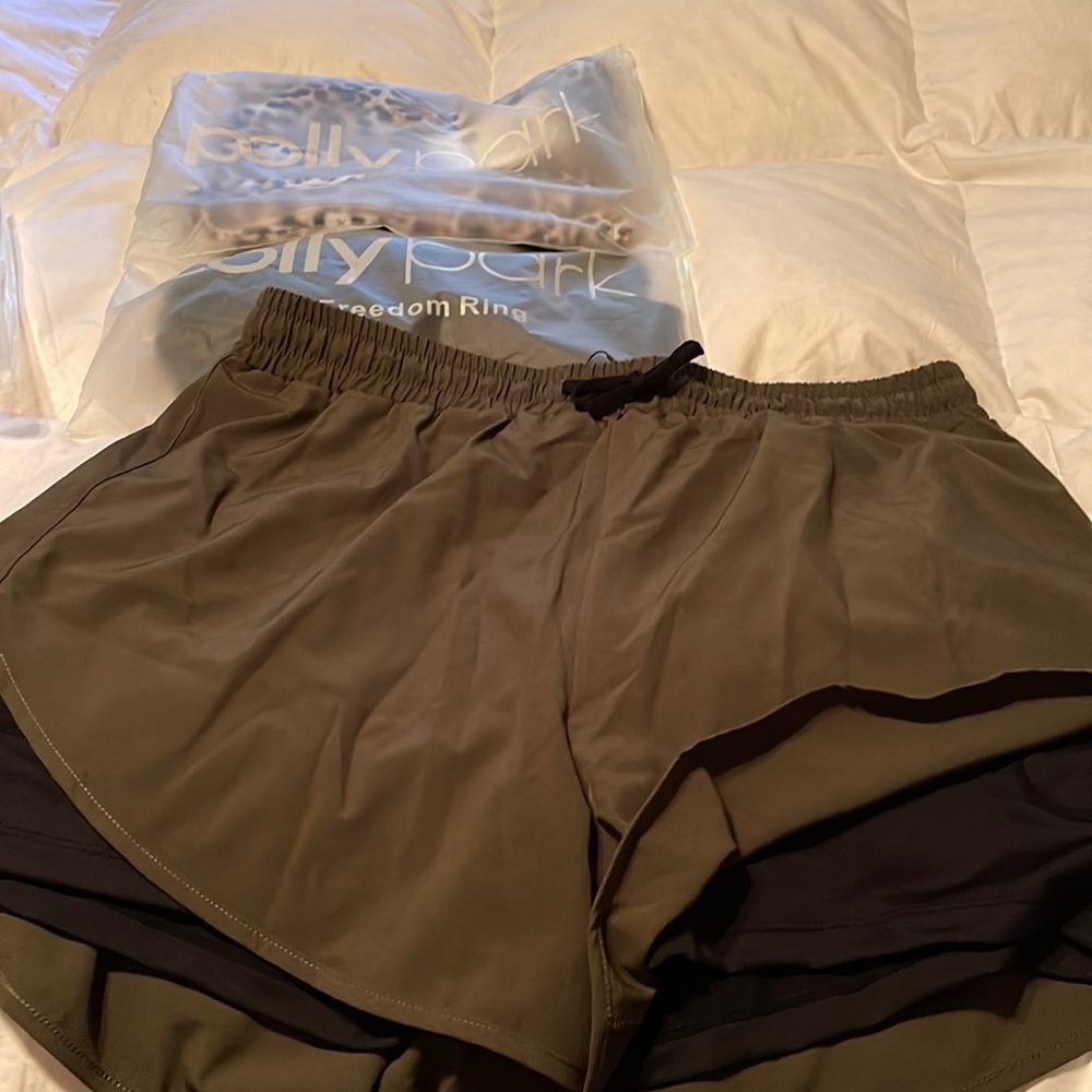 Never worn poly Park running shorts . Black, dark green, leopard print.